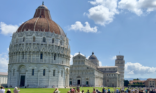 Full shot of Cathedral Square in Pisa, Italy, including the Leaning Tower, the Pisa Cathedral, and the Baptistry of Pisa dome