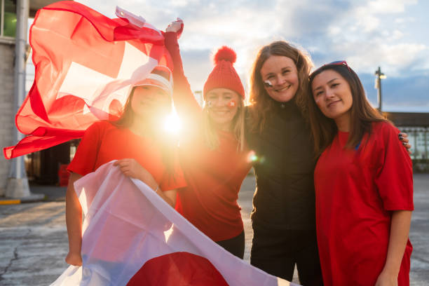 istock Group of supporters rejoices holding flag. 1621772852