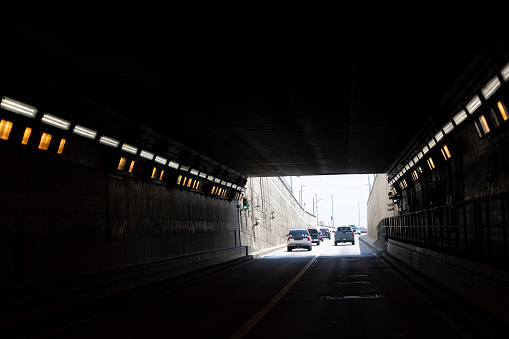 Navigating through a dark tunnel: POV car driver in challenging conditions in Virginia.