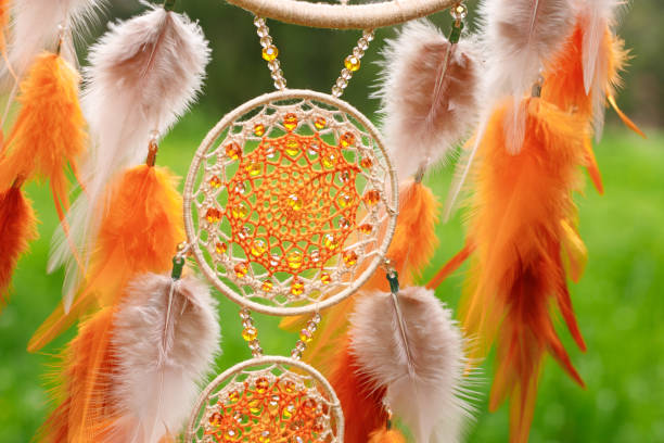 istock Handmade dream catcher with feathers threads and beads rope hanging 1621884914