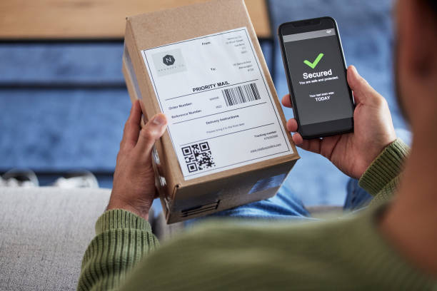 istock Package label, phone screen and person hands reading security check, ecommerce safety scan or online shopping order. Tick, box. shipping and home customer with smartphone, delivery or product barcode 1621885461