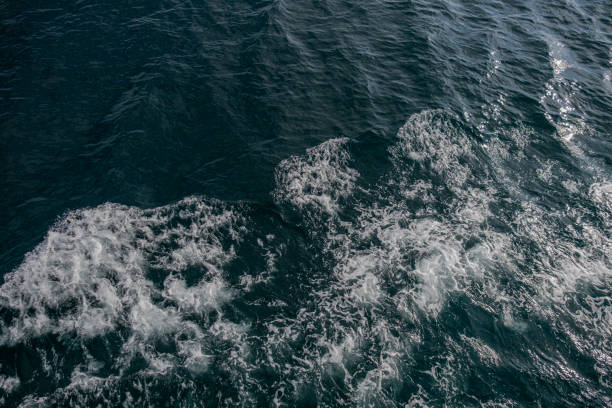 istock waves like white foam in the sea 1621889090
