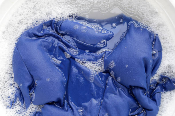 istock T-shirt soak in powder detergent water dissolution, washing  cloth. Laundry concept 1621913656