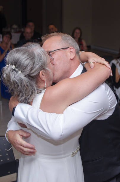 istock Groom and bride kissing 1621958380