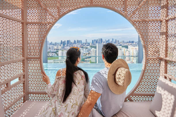 istock Asian couple relaxing in a cabana by hotel pool 1622038317