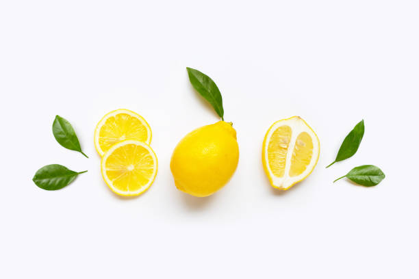 istock Fresh lemon with green leaves on white. 1622047020