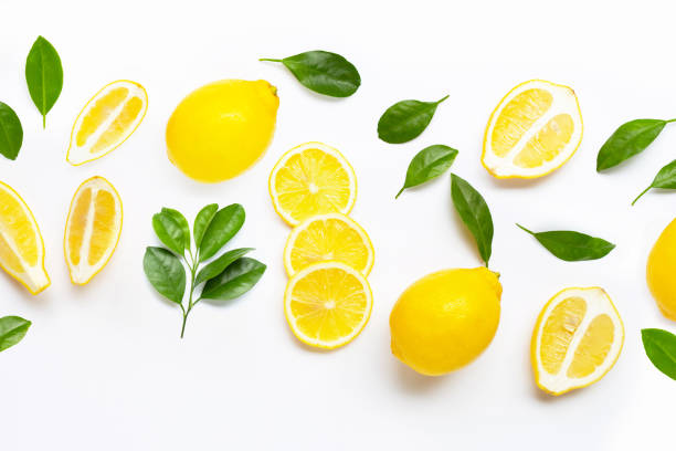 istock Fresh lemon with green leaves on white. 1622050496