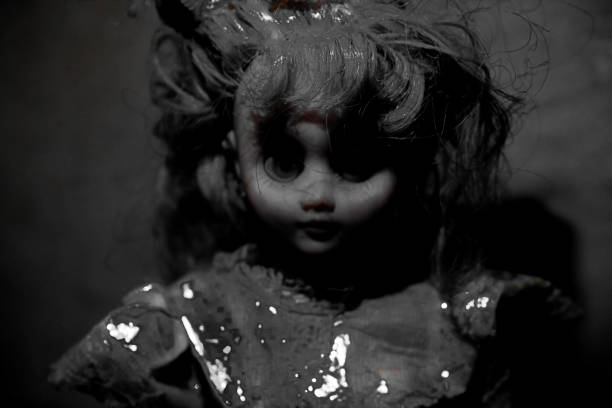 istock Vintage evil spooky doll in the darkness. 1622055679