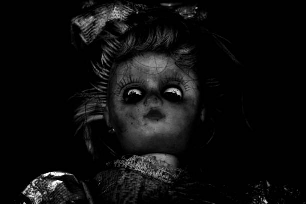 istock Vintage evil spooky doll in the darkness. 1622055718