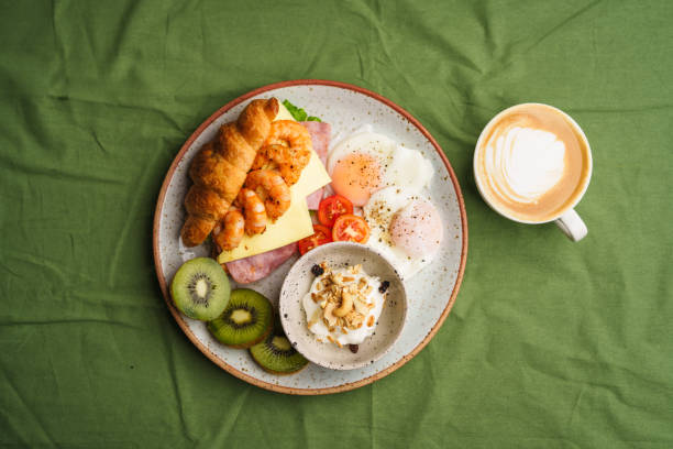 istock Breakfast sandwiches, croissants, ham, cheese, shrimp, fried eggs and yogurt. 1622067496