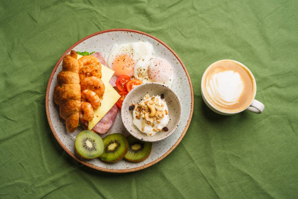 istock Breakfast sandwiches, croissants, ham, cheese, shrimp, fried eggs and yogurt. 1622067498