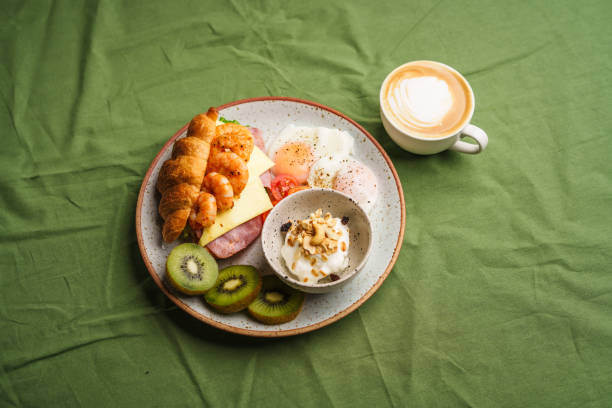 istock Breakfast sandwiches, croissants, ham, cheese, shrimp, fried eggs and yogurt. 1622067573