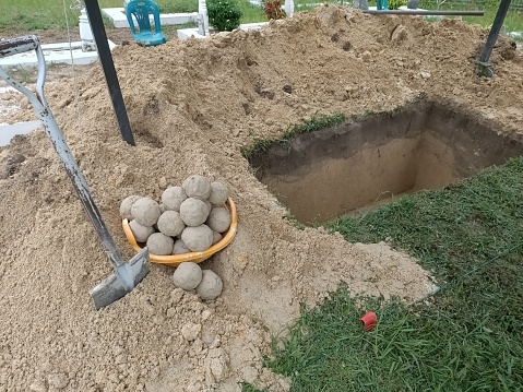 Muslim cemetary newly dug  empty grave hole. Photo taken in Malaysia