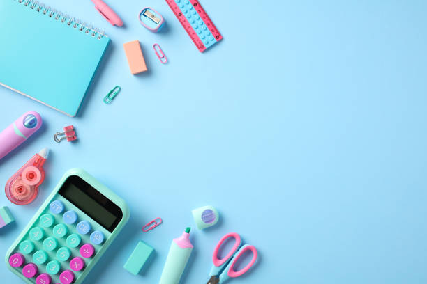 istock Back to school concept. School supplies on pastel blue background. Flat lay composition with calculator, paper notebook, scissors, pencils, pens, sharpeners, erasers 1622126188