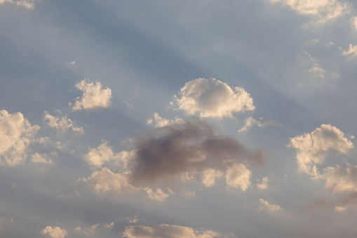 Colorful dramatic sky with clouds. Sunset with sun rays