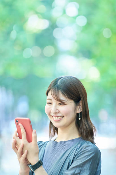 istock Young woman looking at smartphone screen 1622167940