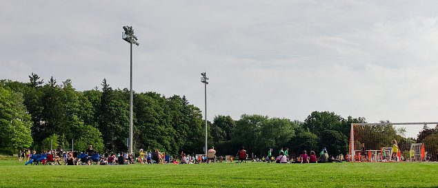 Fergus, Ontario, Canada-08 17 2023: People watching a youth soccer match in a fergus Victoria Park.