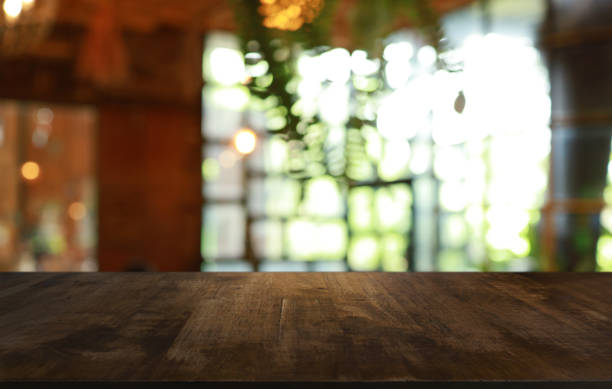 istock Wood table top in front of abstract blurred background. Empty wooden table space for text marketing promotion. blank wood table surface copy space 1622173897