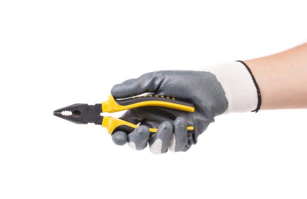 istock A gloved hand holds pliers. 1622173929