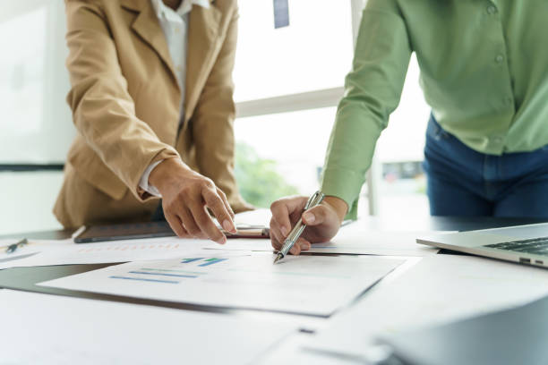 istock Team leader coach teach young workers explain on paper for business plan listen talkative coworker and discussing new project presentation Serious professional advisor consultingÂ in office. 1622174140