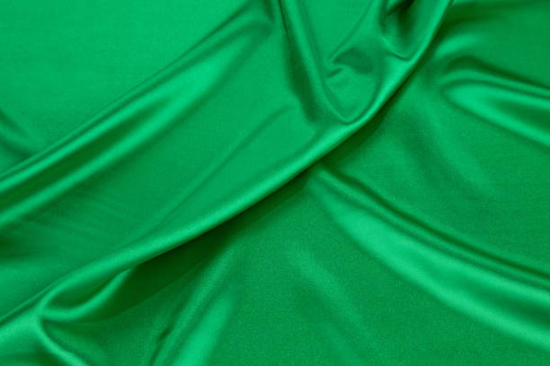 istock Green silk cloth with some soft folds. 1622178819