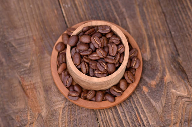 Coffee beans in a wooden bowl