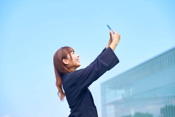istock young woman holding a smartphone 1622181564