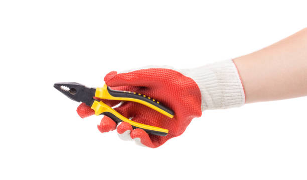 istock A gloved hand holds pliers. 1622184995