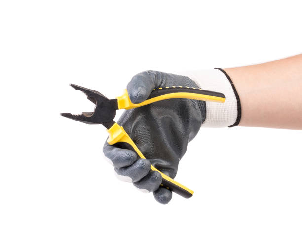 istock A gloved hand holds pliers. 1622185001