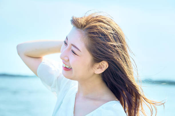 istock woman walking on the beach 1622186036