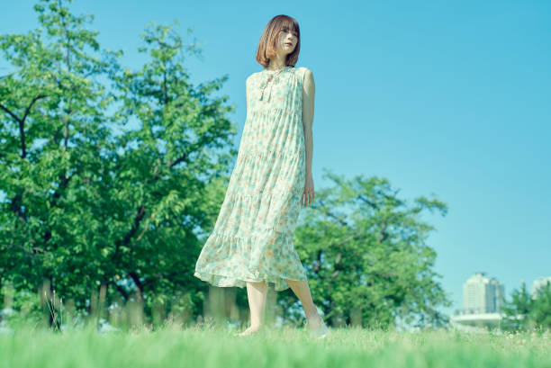 istock Young woman walking in a green space 1622212276