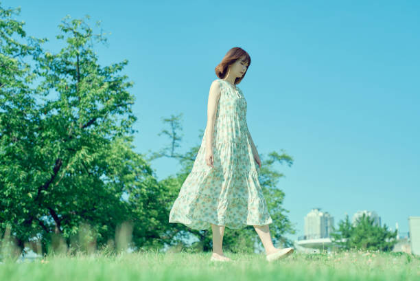 istock Young woman walking in a green space 1622214450