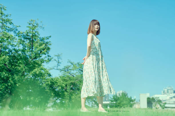istock Young woman walking in a green space 1622217117