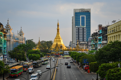 Yangon, Myanmar - Feb 1, 2017. View of main street with Sule Pagoda at sunset in Yangon, Myanmar. Yangon is the country main centre for trade industry and tourism.