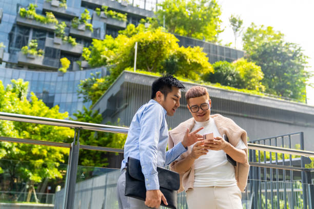 istock Asian business people working together outside office. 1622300005