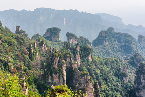 Awesome view of natural quartz sandstone pillars of the Tianzi Mountains (Avatar Mountains) in the Zhangjiajie National Forest Park, Hunan Province, China. Fabulous landscape.