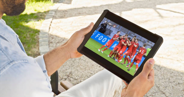 istock Man watching football on digital tablet 1622301596