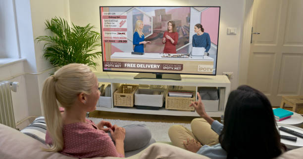 istock Female friends watching TV at home 1622301621