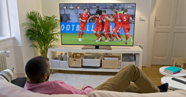 istock Man watching football on TV 1622301624