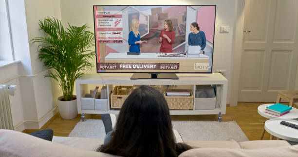 istock Young woman watching TV 1622301627