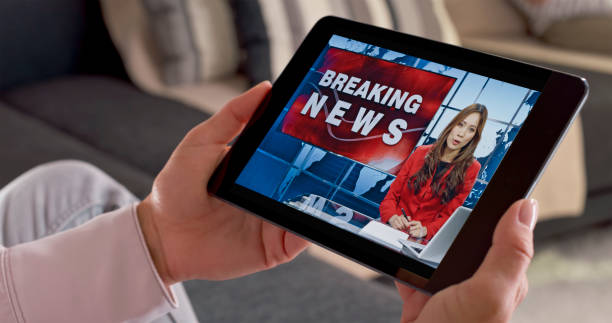 istock Woman watching news on digital tablet 1622301633