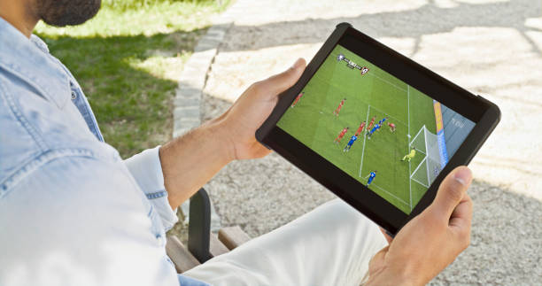 istock Man watching football on digital tablet 1622305580
