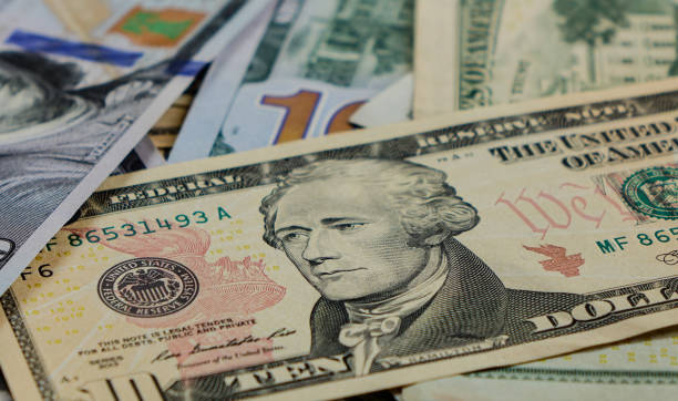 istock American banknotes scattered on the table 1622307186