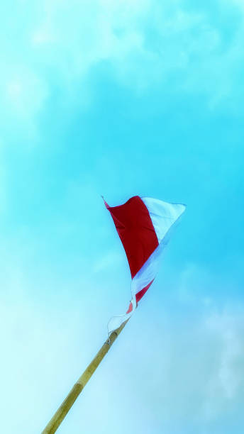 istock A red and white flag fluttering in the blue sky 1622316284