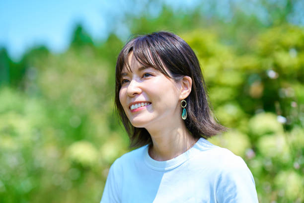 Woman relaxing in green space