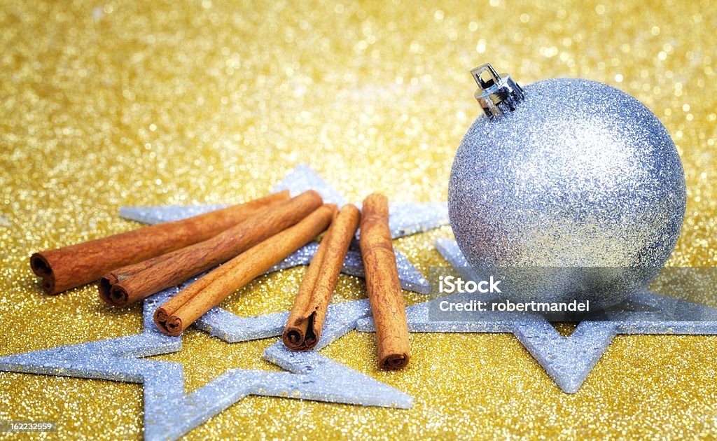 Christmas Bauble Christmas bauble on a golden ground with on glittery background. Advent Stock Photo