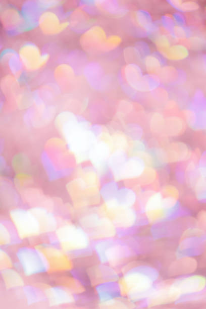 istock Defocused abstract bokeh background with pink pastel colored hearts, flare from lights, blurred bokeh holiday, celebration wallpaper. love and romance aesthetic photo, glittering lights pattern 1622329621