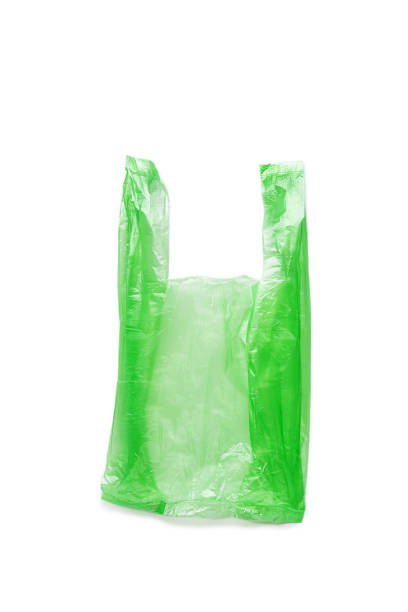 istock Close up Green plastic bag isolated on white background, cut out object, design element. Single-use polythene packet, Biodegradable packaging waste, Disposable bag for food, bag free day 1622330165