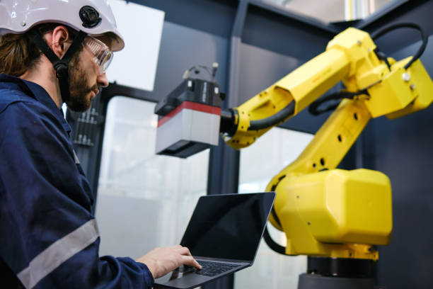 istock Multiracial tachnicial engineer training with robot arm 1622330710