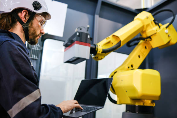 istock Multiracial tachnicial engineer training with robot arm 1622330998